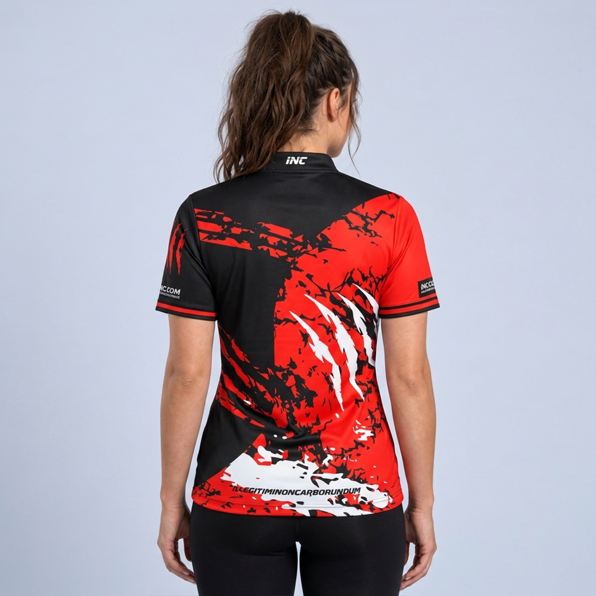 Back view of the Alpha Women's Black White and Red Darts Shirt, highlighting the breathable contoured back paneling and flexible shoulder construction for unrestricted movement.