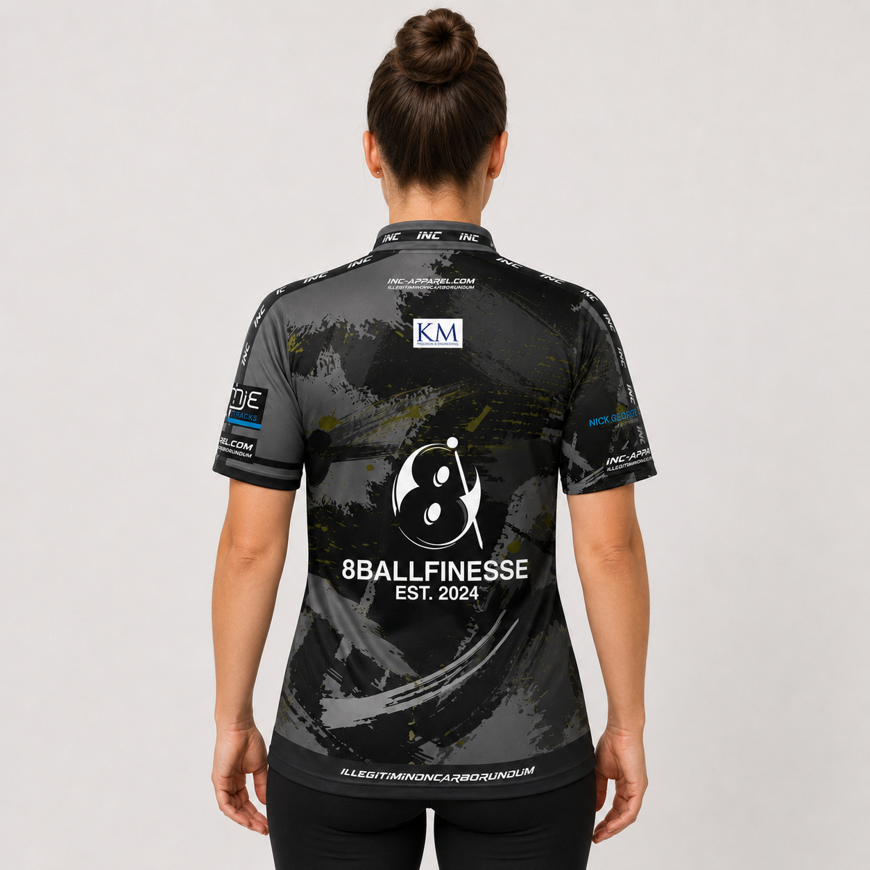 Back view of The Cue Club Women's 8 Ball Finesse Pool Shirt, showcasing the breathable contoured back paneling and streamlined shoulder cut.