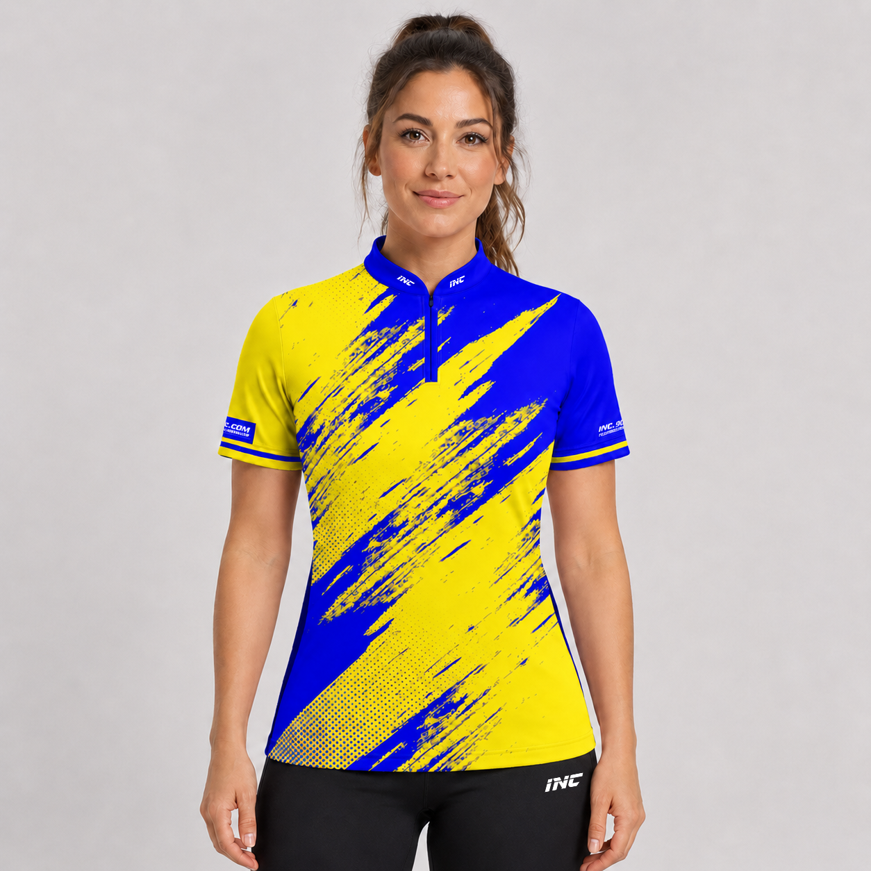 Front view of the Incursus Women's Blue and Yellow Darts and Pool Shirt, showcasing the vibrant contrast panel design, tailored feminine silhouette, and sleek collar.