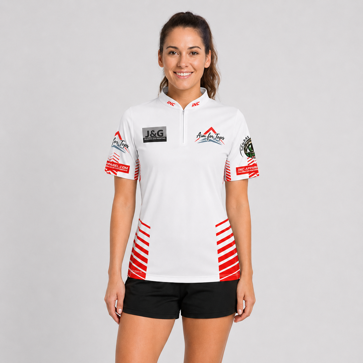 Front view of the Official Aim For Tops Women's White Darts Shirt, featuring the custom target graphic, crisp white paneling, tailored silhouette, and collar.