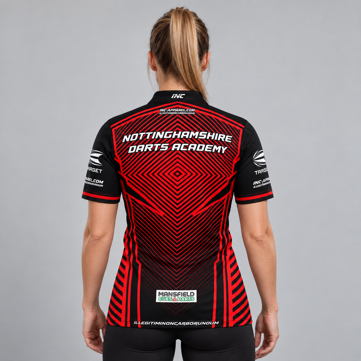 Back view of the Official Nottinghamshire Darts Academy Prodigy Women's Shirt, highlighting the breathable contoured back paneling and flexible sleeve cut for smooth throwing motion.