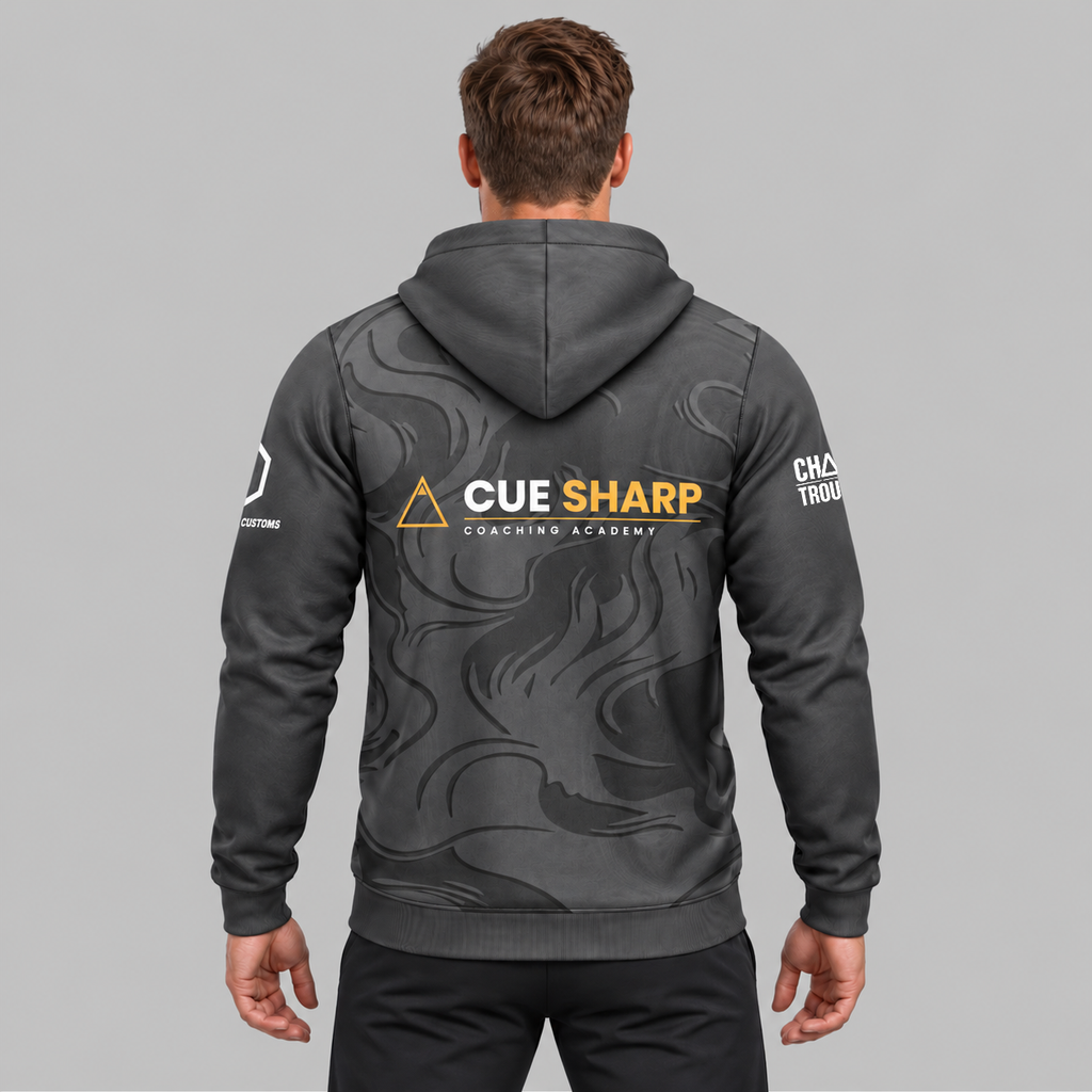 Back view of the Official Cue Sharp Coaching Unisex Hoodie, showing the plush dark charcoal hood, relaxed athletic back paneling, and subtle upper collar branding.