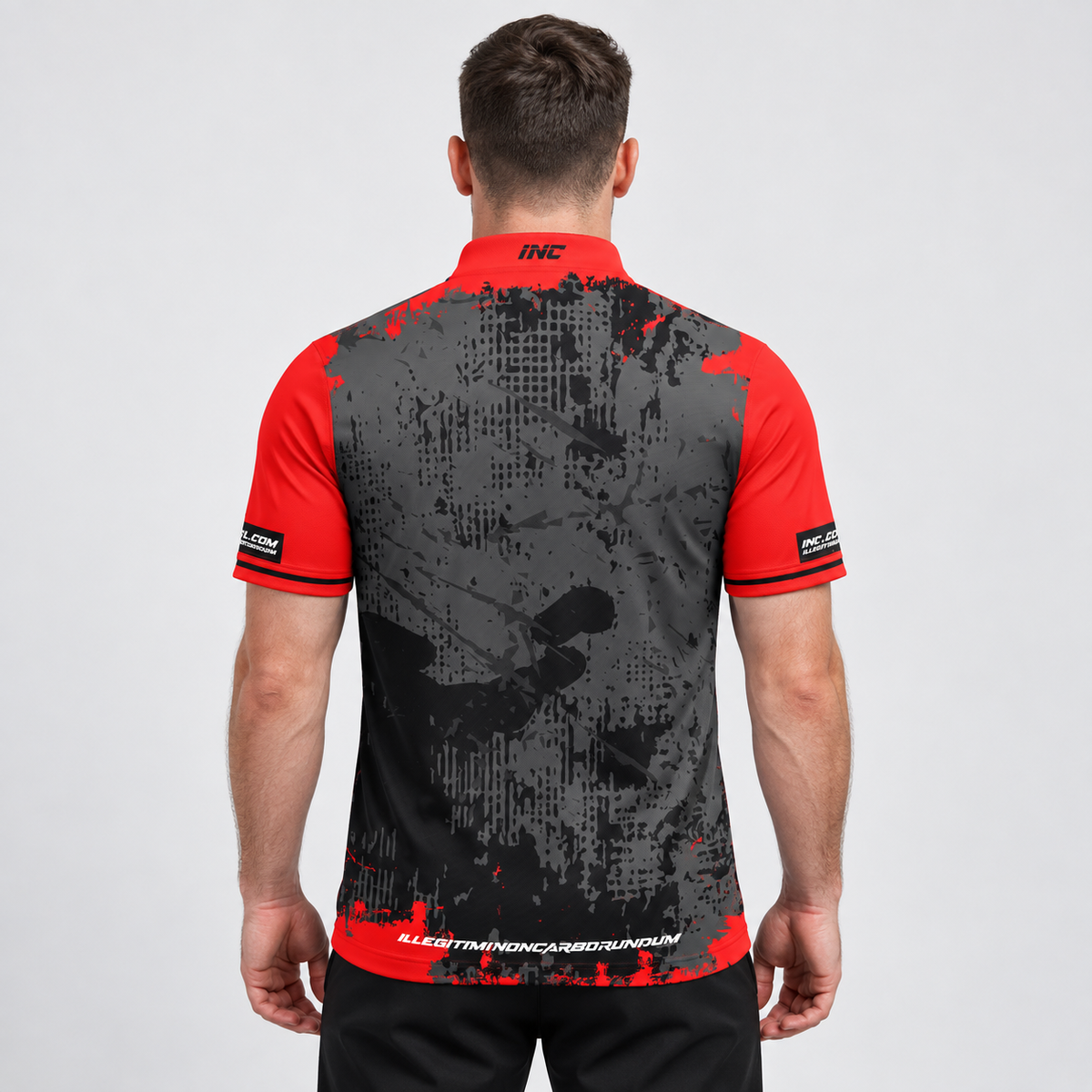 Back view of the Daemon Men and Youth Red and Black Darts Shirt, highlighting the breathable rear paneling and flexible shoulder construction for unrestricted movement.