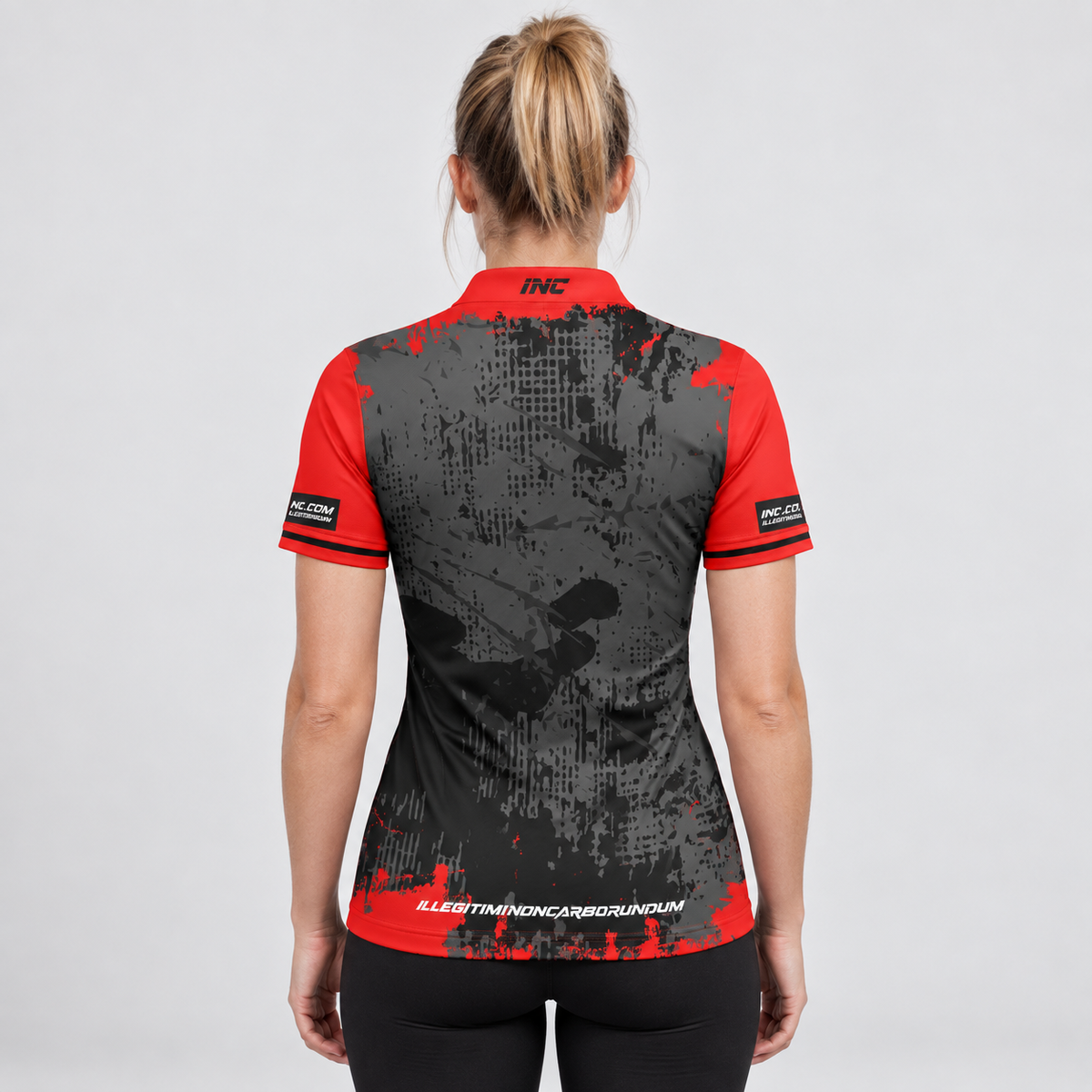 Back view of the Daemon Women's Red and Black Darts Shirt, highlighting the breathable contoured back paneling and flexible shoulder construction.