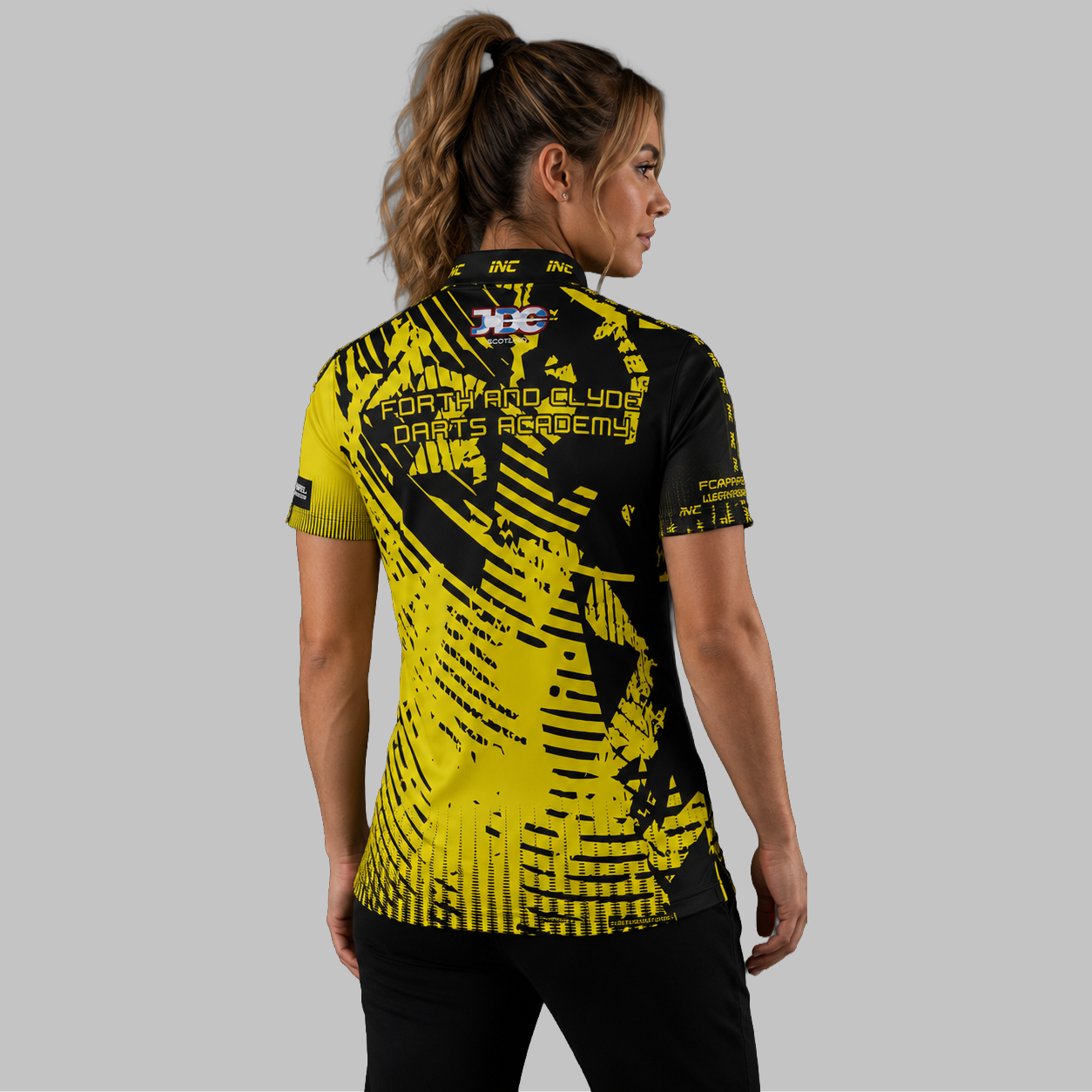Back view of the Women's Forth and Clyde Darts Academy Darts Shirt, showcasing the seamless flow of the sublimated academy design across the shoulders.