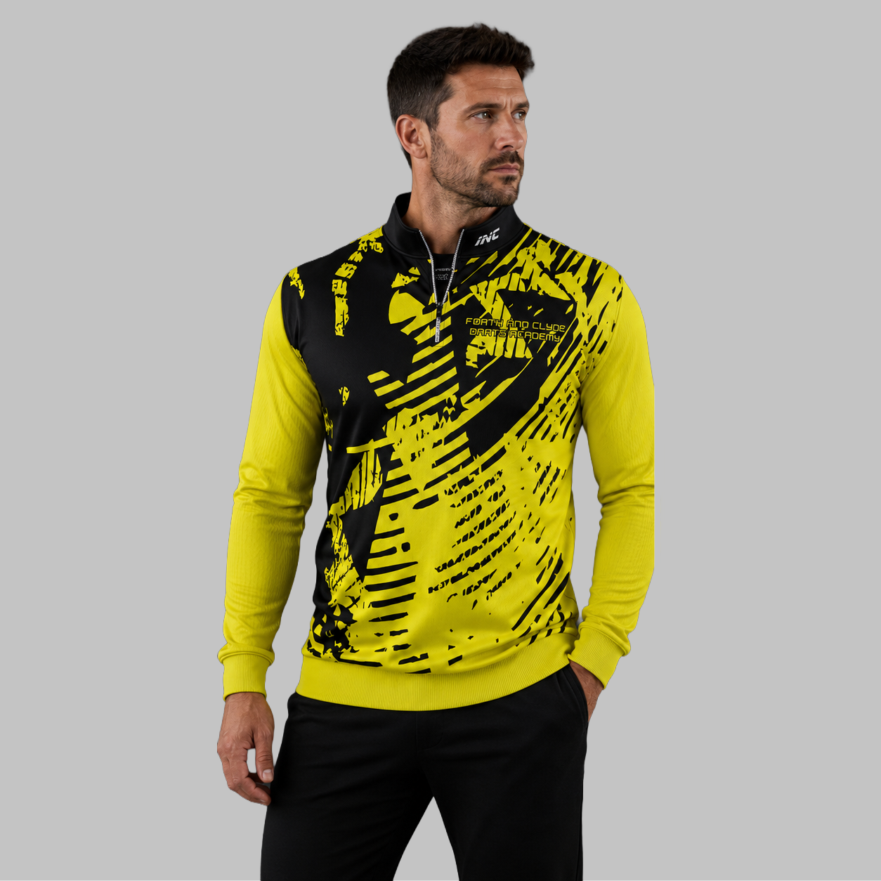 Front view of the unisex Forth and Clyde Darts Academy Quarter Zip Midlayer, highlighting the athletic team styling, stand-up collar, and official academy crest.