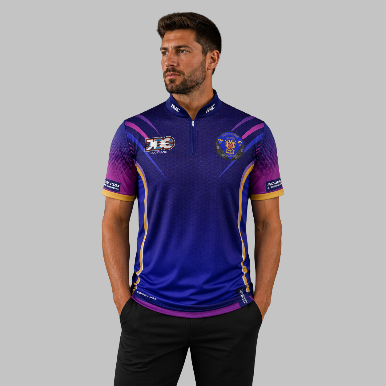 Front view of the Men and Youth JDC Perthshire Darts Academy Shirt, showing the vibrant academy colors, professional athletic collar, and official crest.