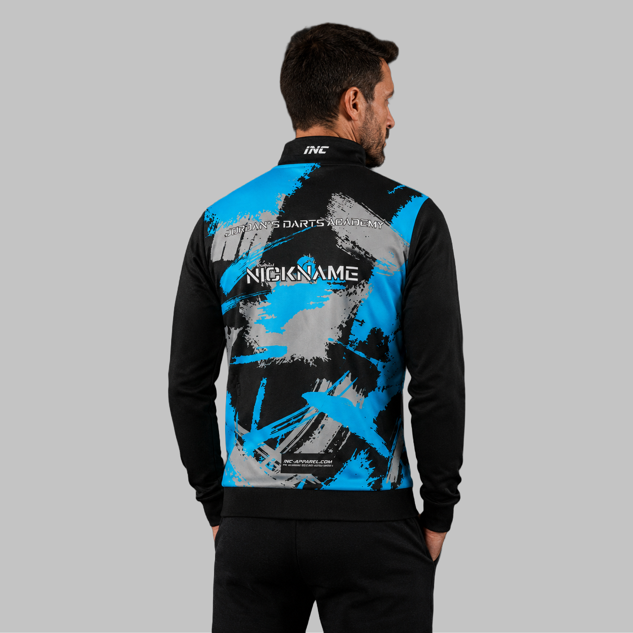 Back view of the unisex Jordan's Darts Academy Tournament Jacket, showing the clean team color panels and comfortable outer-shell design across the shoulders.