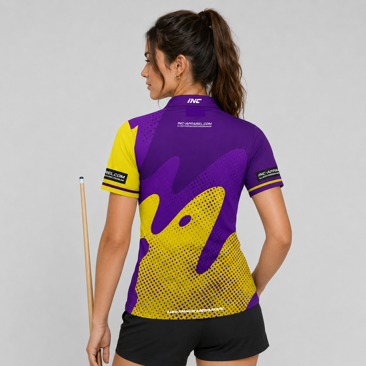 Back view of the Womens Ludicrus purple and yellow darts and pool shirt, showing the continuation of the bold graphic pattern layout.
