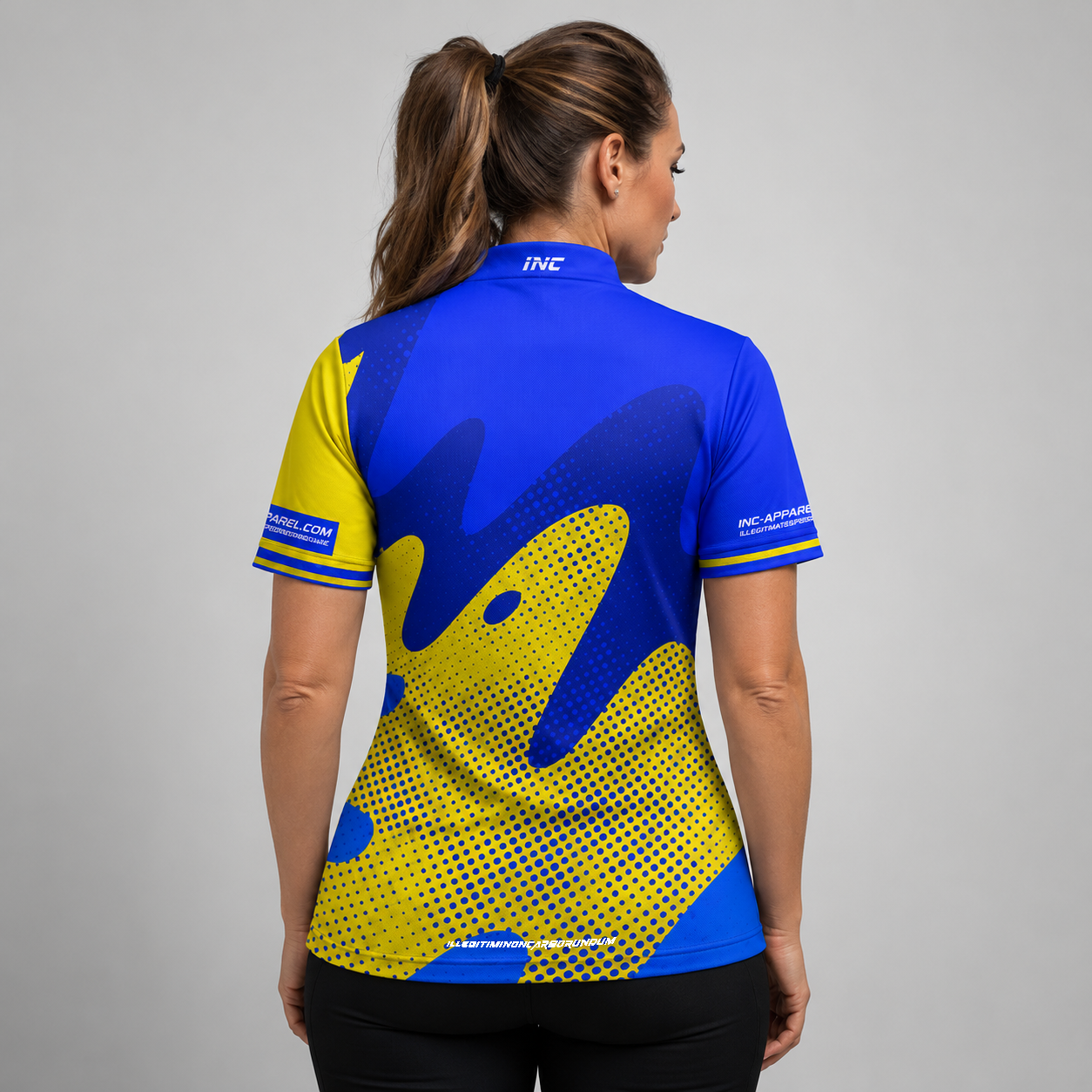 Back view of the Womens Ludicrus royal blue and yellow darts and pool shirt, showing the continuation of the bold graphic pattern layout.