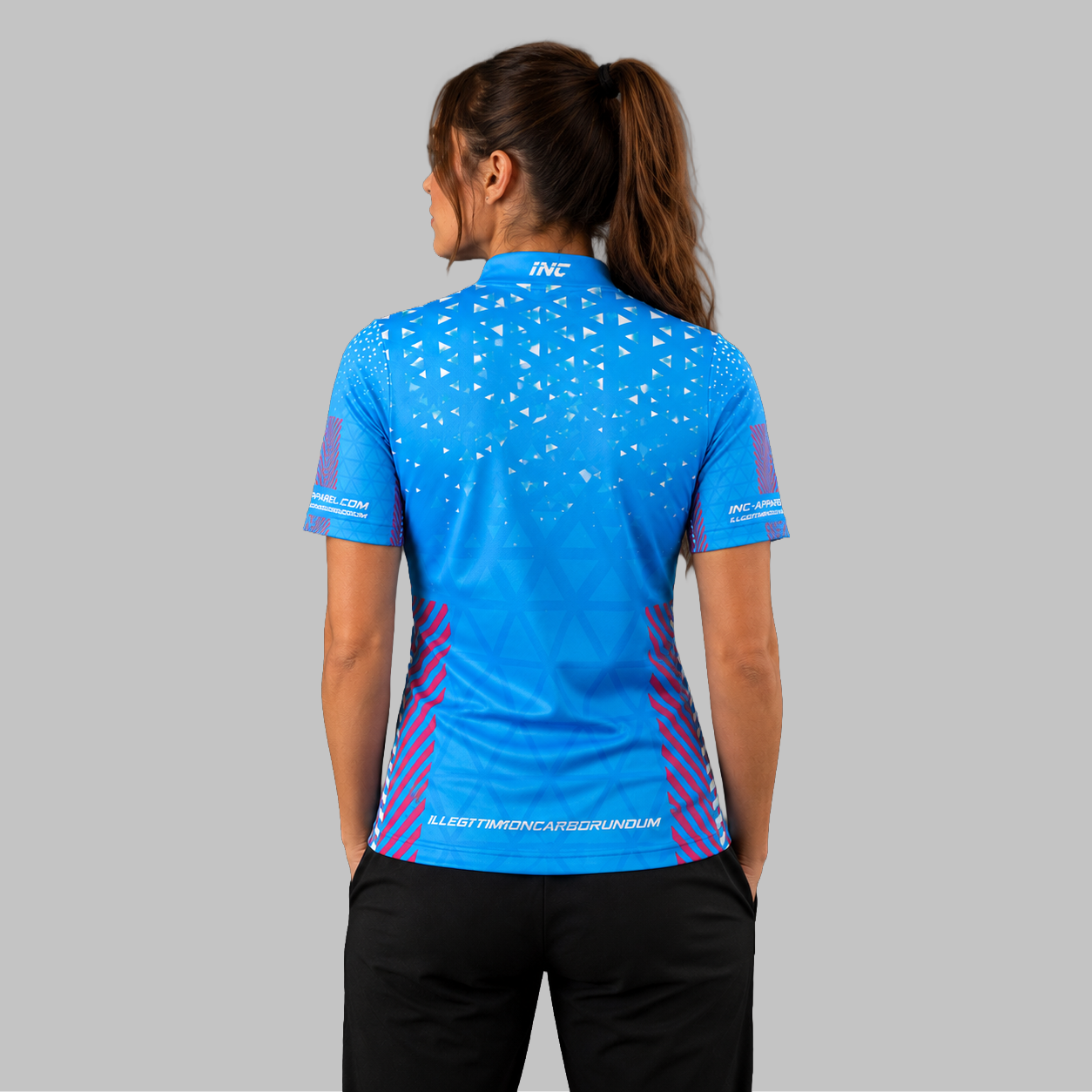 Back view of the Women's Magnus blue, pink, and white darts and pool shirt, highlighting the seamless continuation of the premium athletic pattern across the shoulders.