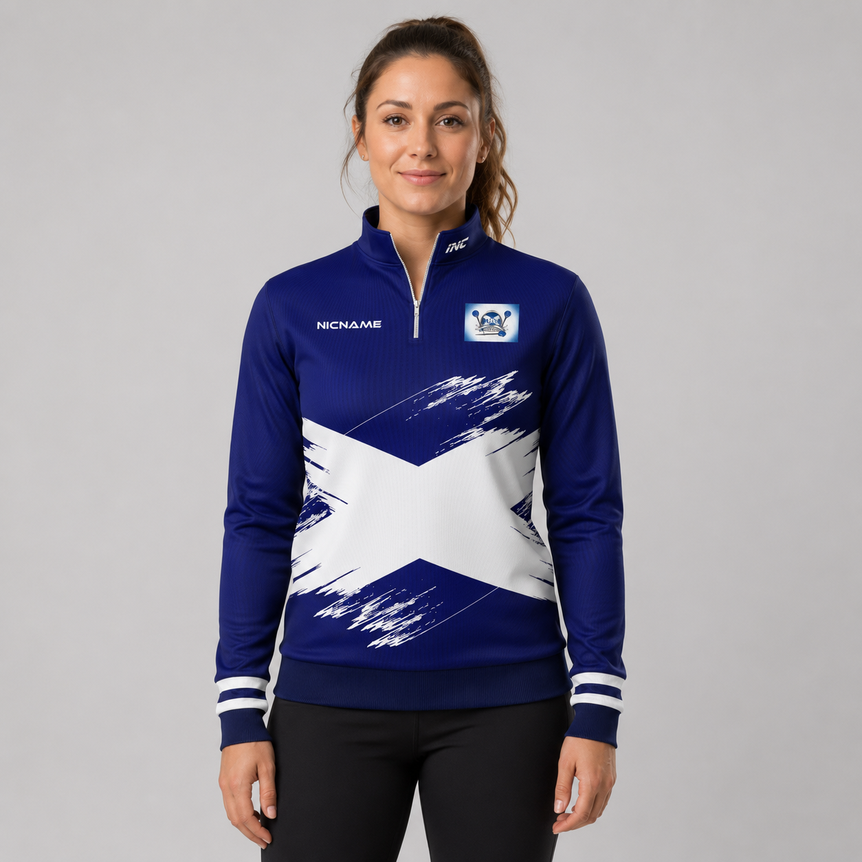Front view of the unisex North Ayrshire Darts Academy Quarter Zip Midlayer, highlighting the athletic team styling, stand-up collar, and official academy crest.