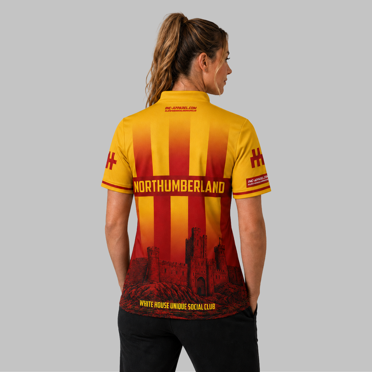 Back view of the Women's Northumberland County Darts Shirt, showcasing the clean silhouette and flexible fabric paneling across the shoulders.