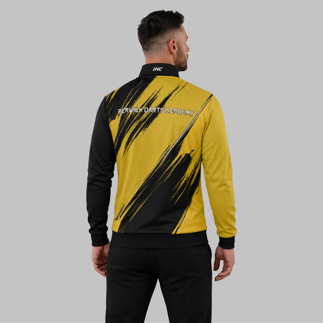 Back view of the unisex Official Berwick Darts Academy Tournament Jacket, showing the clean athletic panels and comfortable outer-shell design across the shoulders.