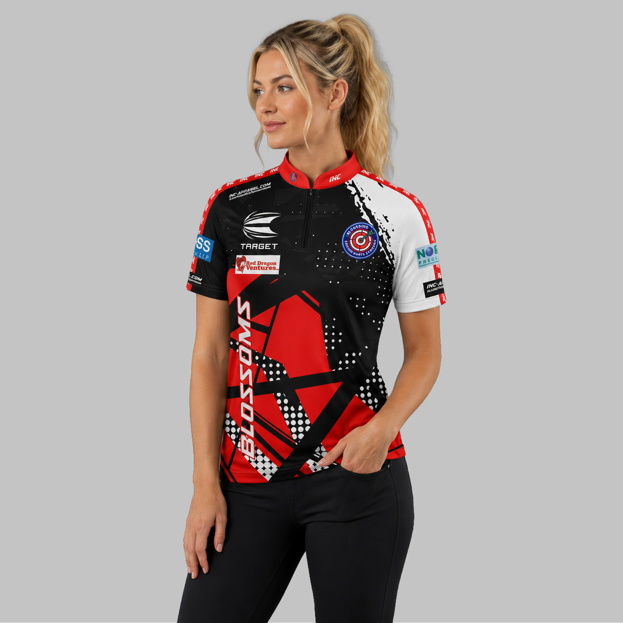 Front view of the Women's Official Blossoms Junior Darts Academy shirt, showing the custom-contoured athletic fit and prominent academy branding.