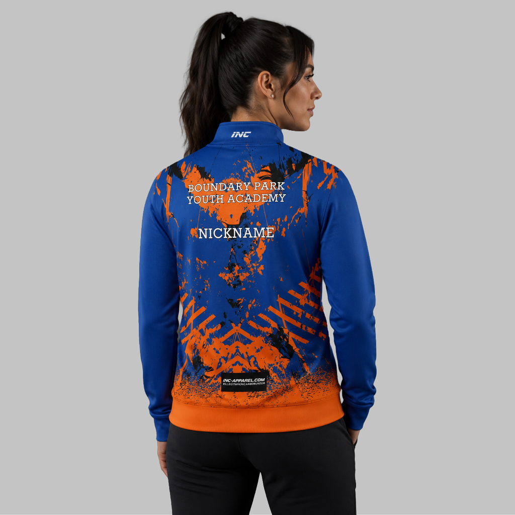 Back view of the unisex Official Boundary Park Youth Darts Academy Quarter Zip Midlayer, showing the clean athletic silhouette and flexible shoulder construction.