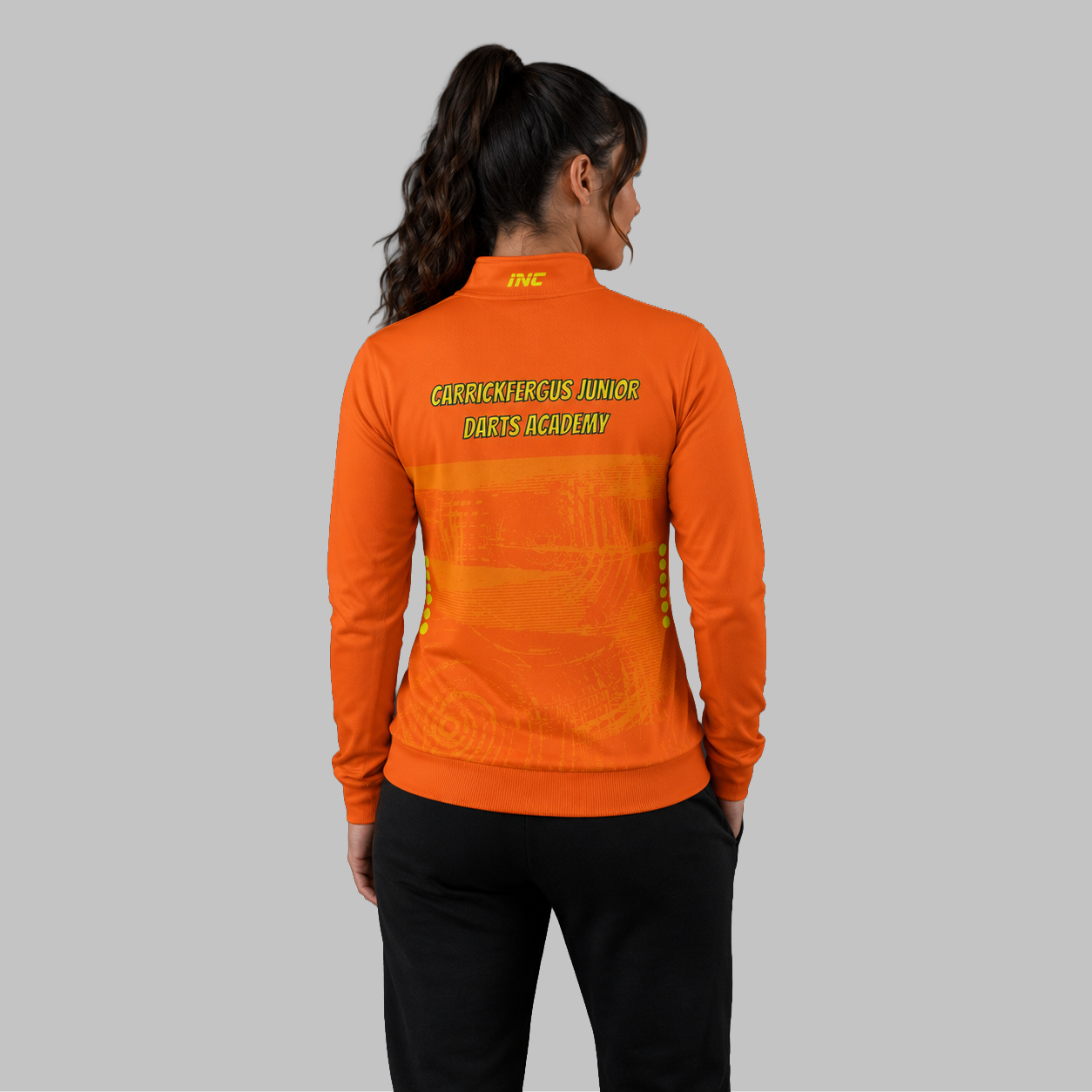 Back view of the unisex Official Carrickfergus Junior Darts Academy Quarter Zip Midlayer, showing the clean athletic silhouette and flexible shoulder construction.