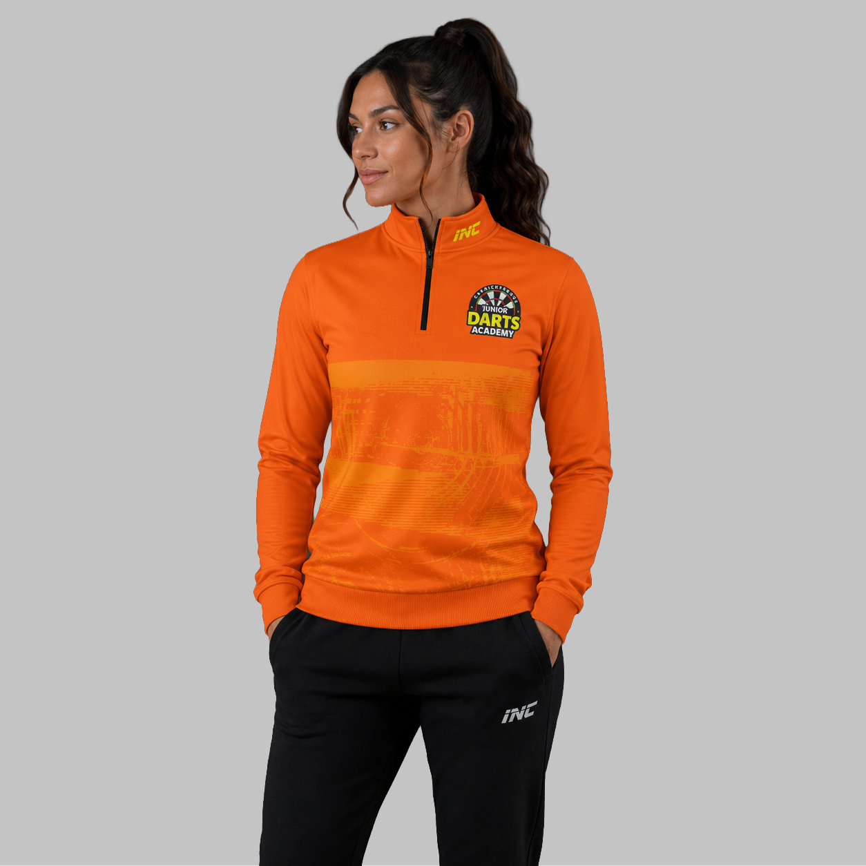 Front view of the unisex Official Carrickfergus Junior Darts Academy Quarter Zip Midlayer, highlighting the athletic pullover design, stand-up collar, and official branding.