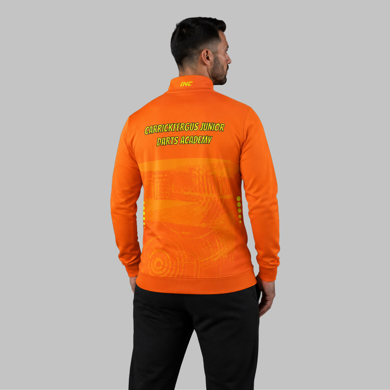 Back view of the unisex Official Carrickfergus Junior Darts Academy Tournament Jacket, showing the clean athletic panels and comfortable outer-shell design across the shoulders.