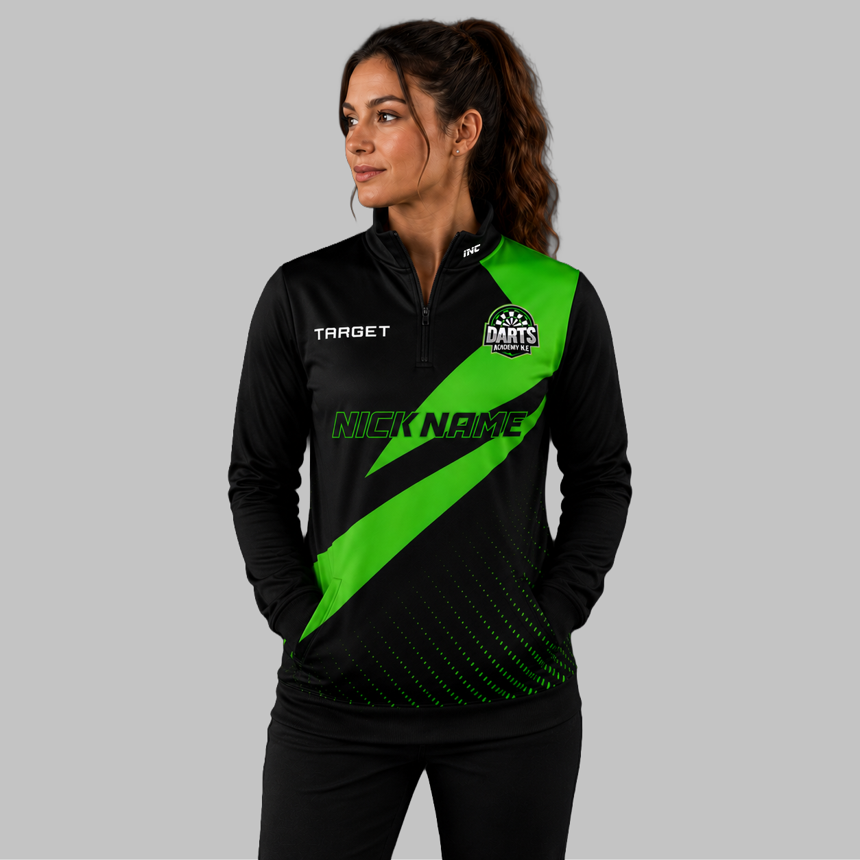 Front view of the unisex Official Darts Academy North East Quarter Zip Midlayer, highlighting the athletic team styling, stand-up collar, and official academy crest.