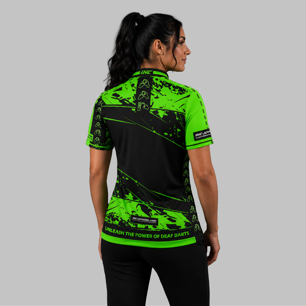 Back view of the Women's Official Deaf Darts Organisation Green and Black shirt, showcasing the seamless flow of the sublimated team design across the shoulders.