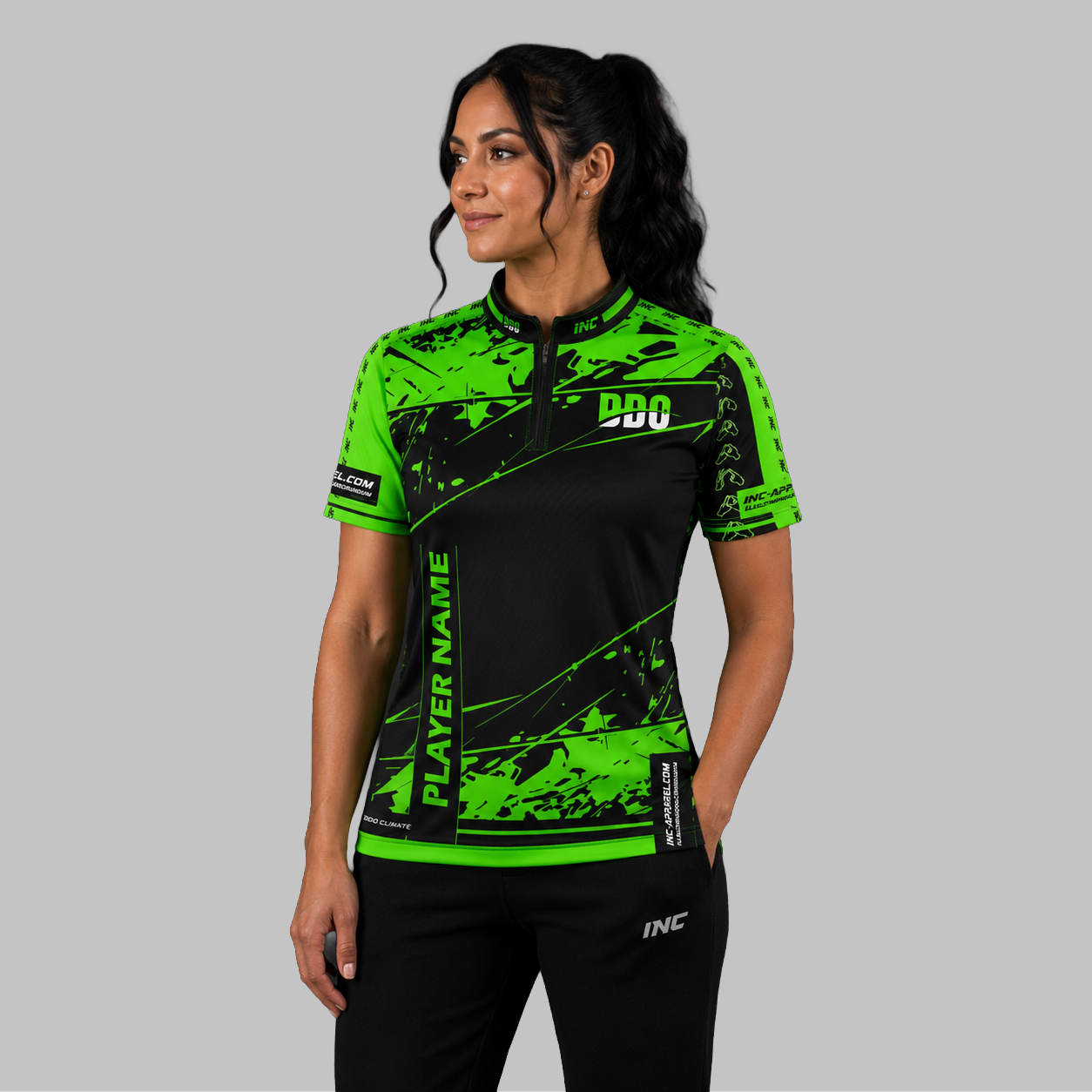 Front view of the Women's Official Deaf Darts Organisation Green and Black shirt, showing the custom-contoured athletic fit and prominent DDO branding.