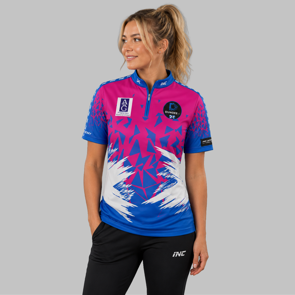 Front view of the Women's Official Dundee Darts Academy League Shirt, showing the custom-contoured athletic fit and prominent league branding.