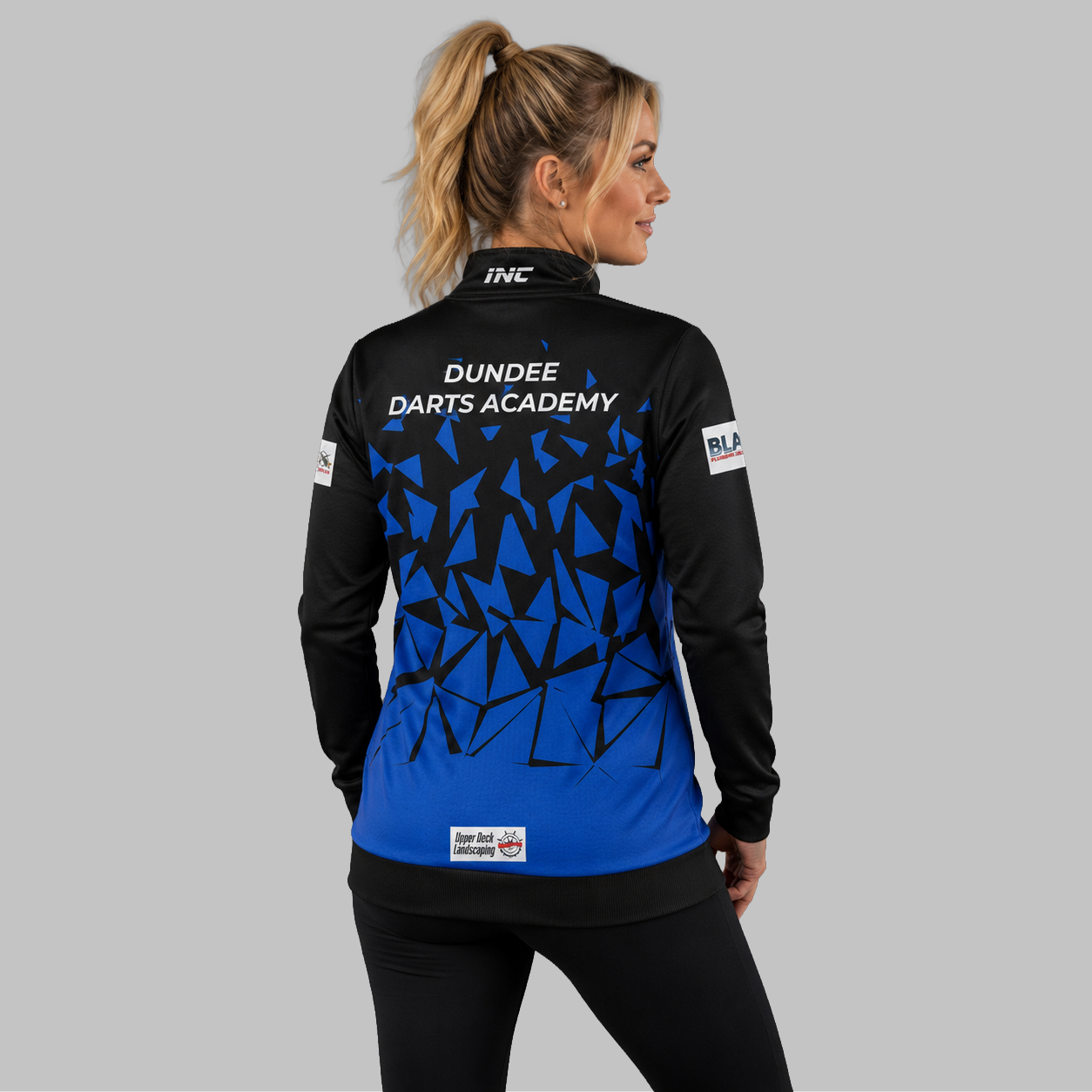 Back view of the unisex Official Dundee Darts Academy Quarter Zip Midlayer, showing the clean athletic silhouette and flexible shoulder construction.