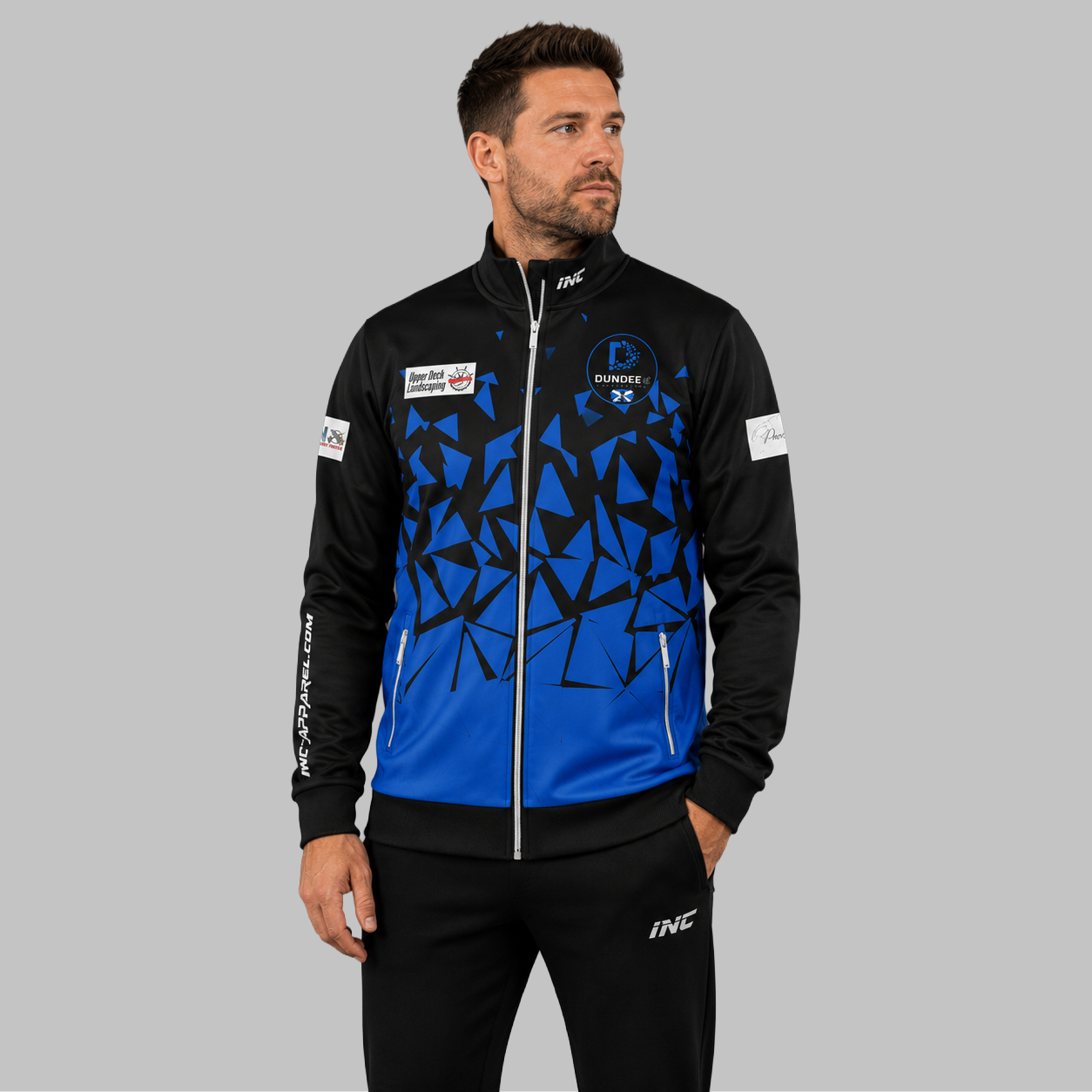 Front view of the unisex Official Dundee Darts Academy Tournament Jacket, highlighting the sleek full-zip design, athletic collar, and prominent academy branding.