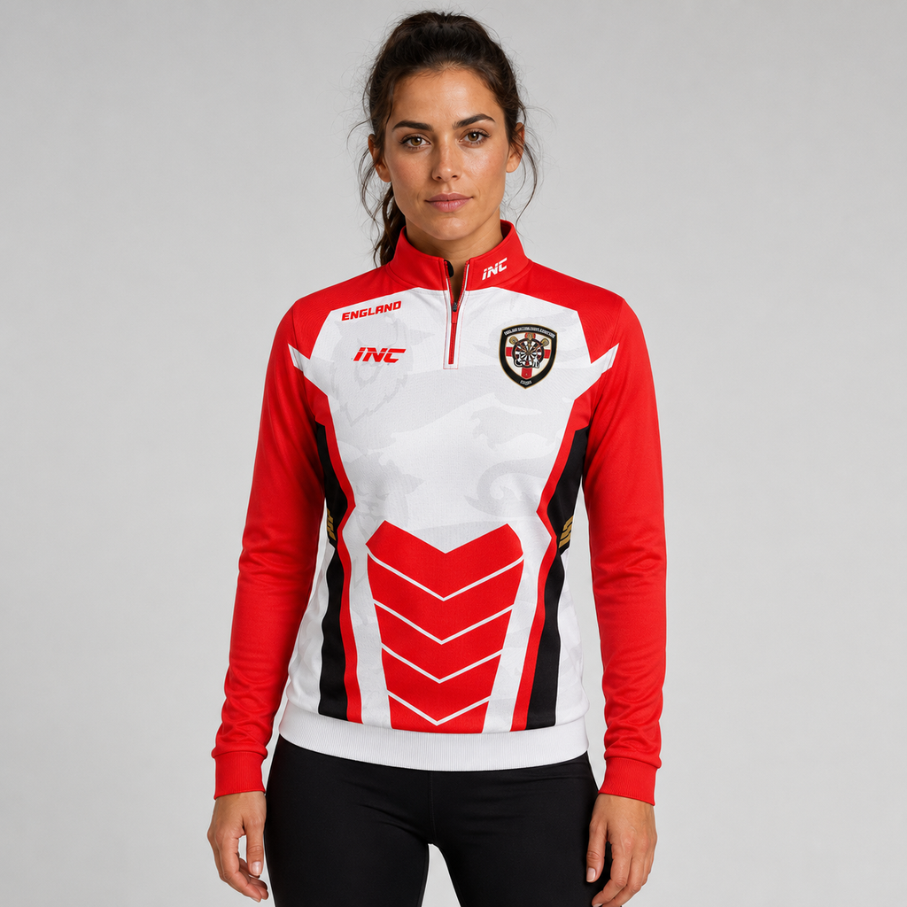 Front view of the womens Official England Inclusio darts team quarter zip midlayer, showing the athletic mock neck collar, protective zipper cover, and sublimated national chest graphics.