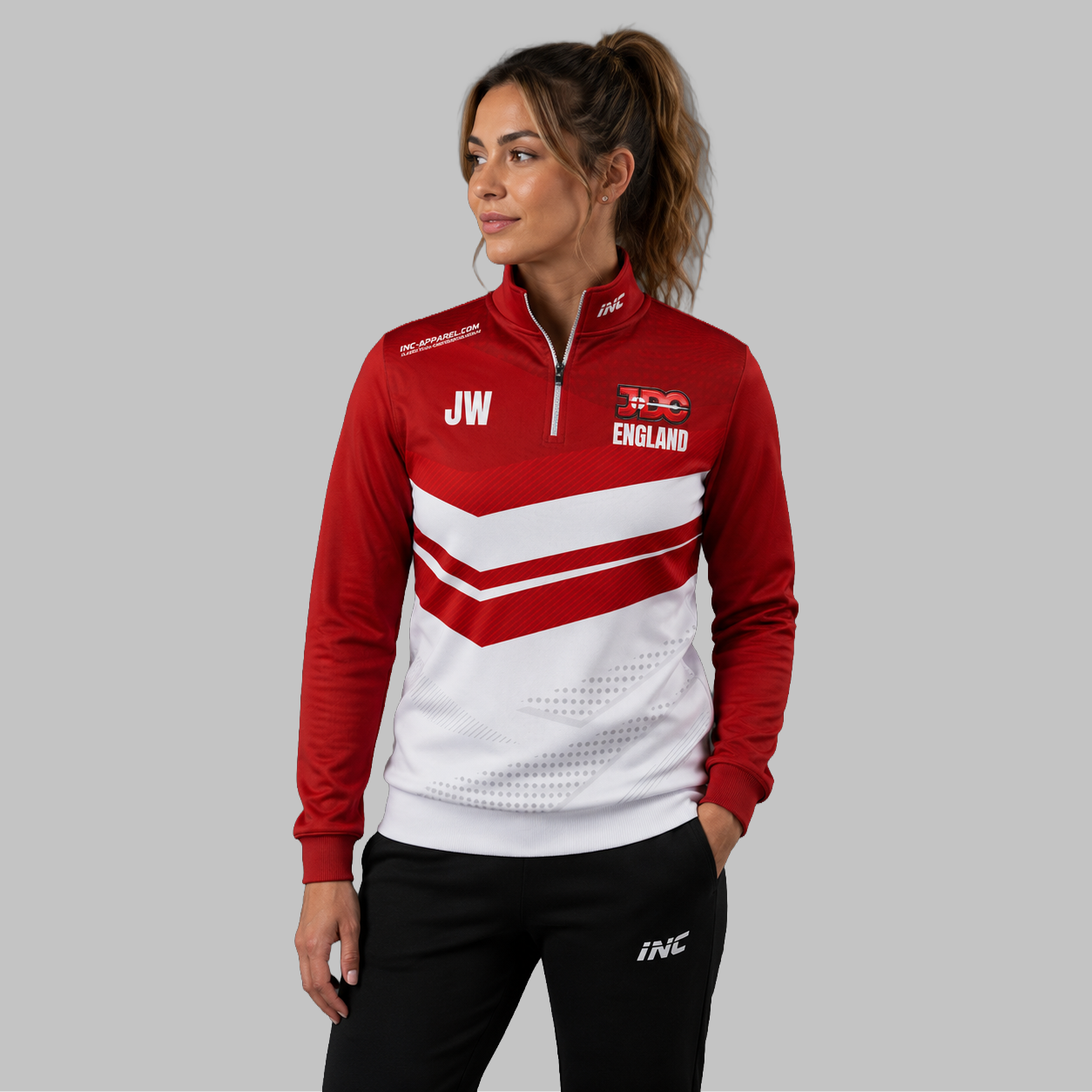 Front view of the unisex Official England JDC Darts Quarter Zip Midlayer, highlighting the athletic national team styling, stand-up collar, and official JDC branding.