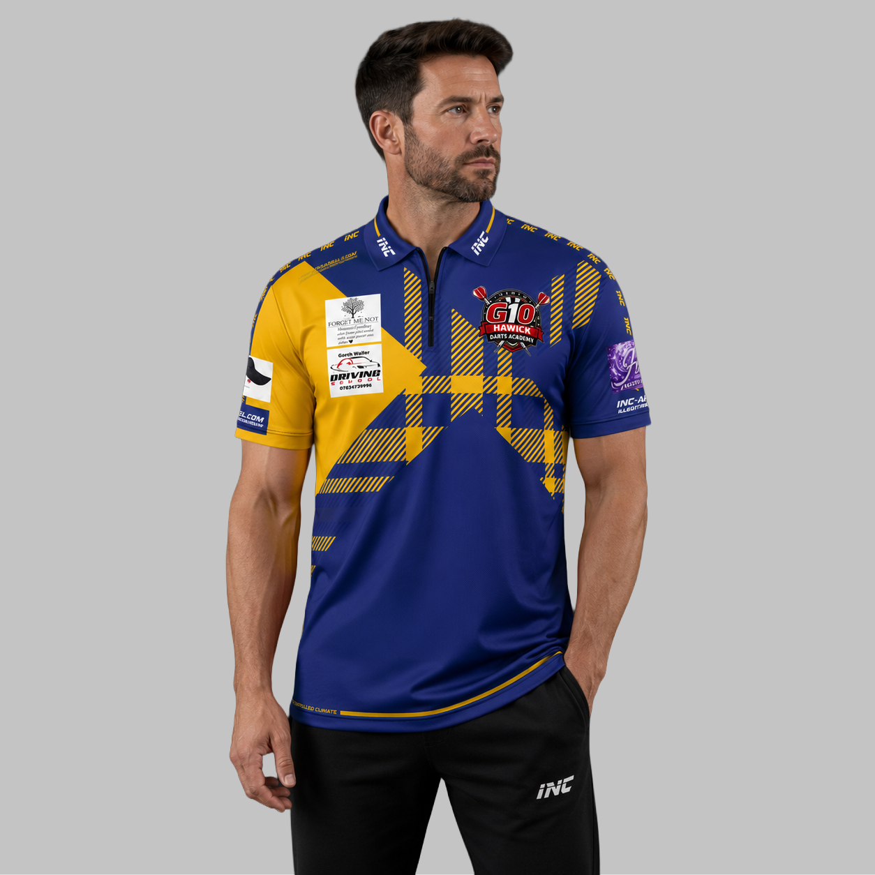 Front view of the Men and Youth Official Hawick Darts Academy Shirt, showing the vibrant academy colors, professional athletic collar, and official crest.