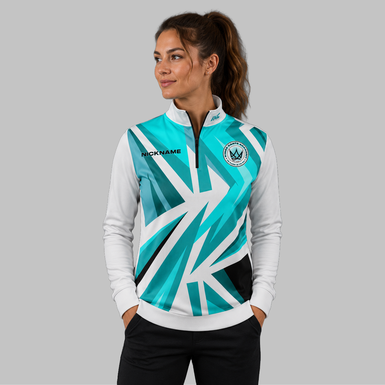 Front view of the unisex Official Kings Darts Academy Quarter Zip Midlayer, highlighting the athletic team styling, stand-up collar, and official academy crest.