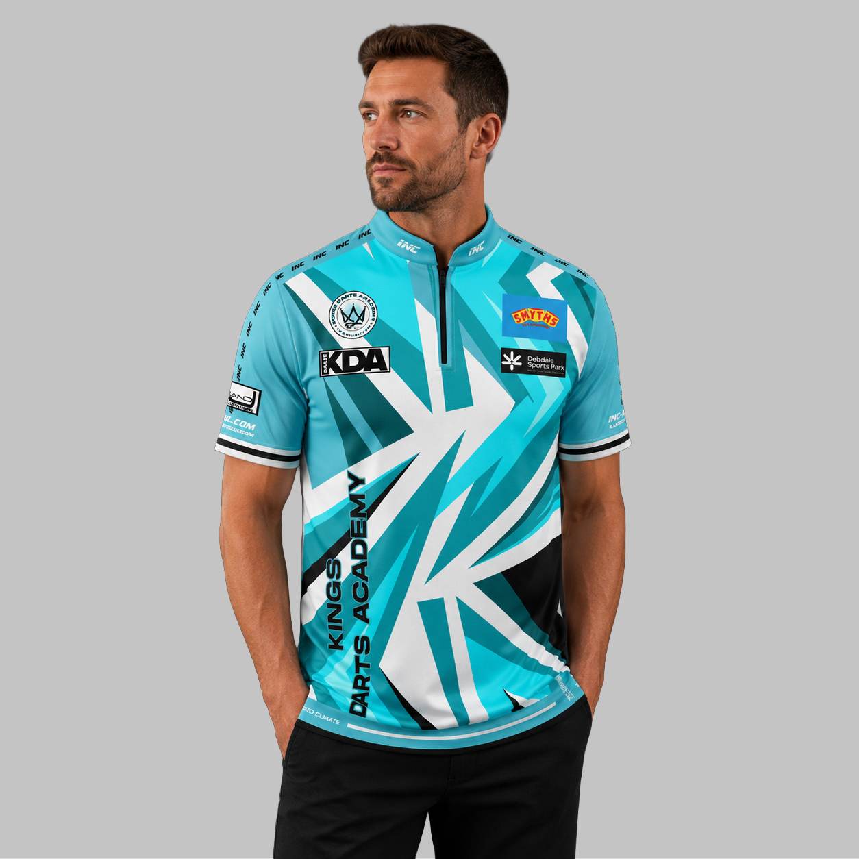 Front view of the Men and Youth Official Kings Darts Academy Shirt, showing the vibrant academy colors, professional athletic collar, and official crest.