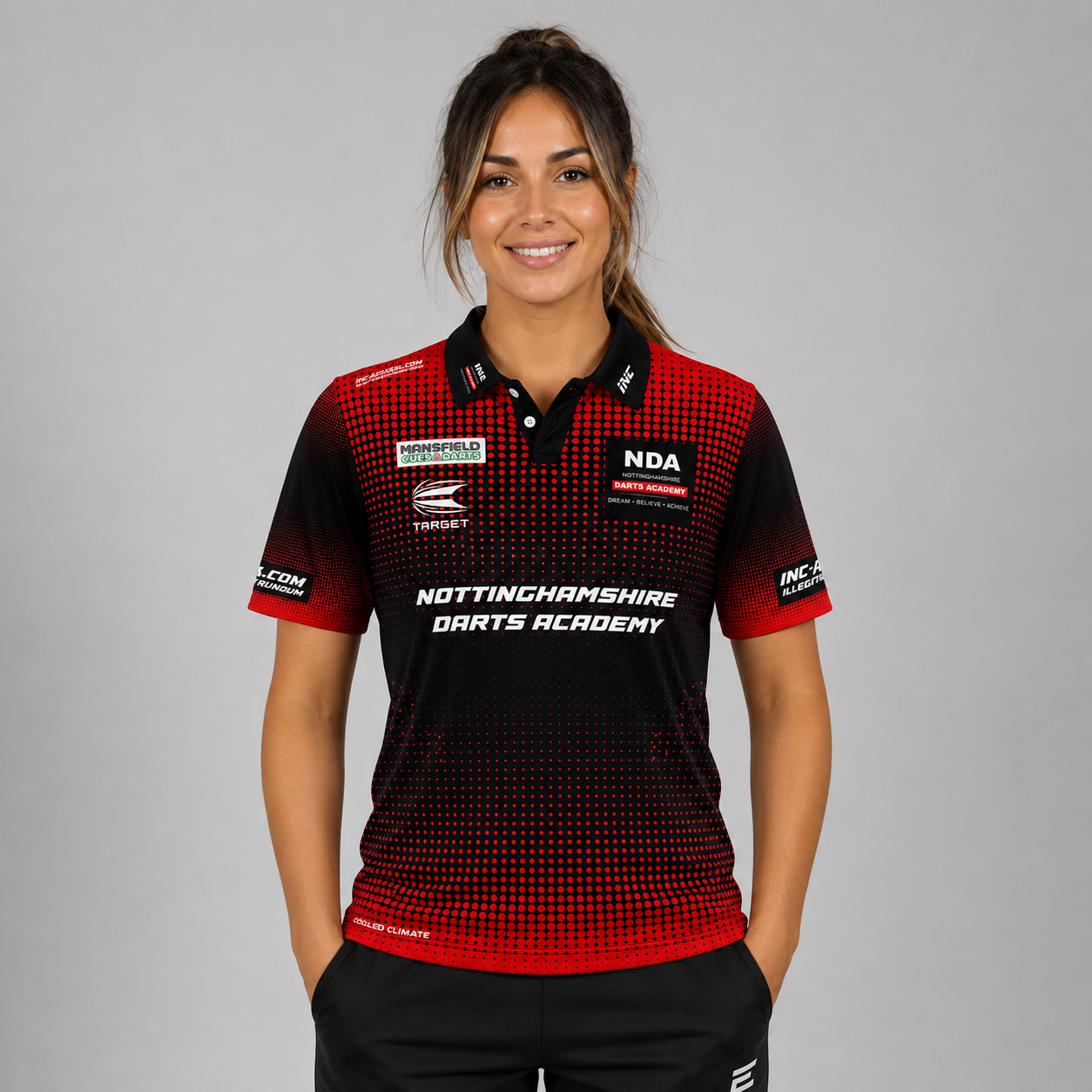 Front view of the Women's Official Nottinghamshire Darts Academy Shirt, showing the custom-contoured athletic fit and official academy crest on the chest.