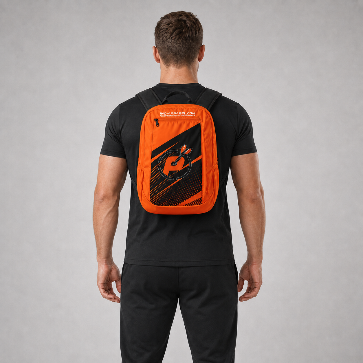 Front view of the Official Prime Sports Darts Academy backpack, highlighting the spacious zipped pockets, dual water bottle mesh compartments, and clean academy branding.