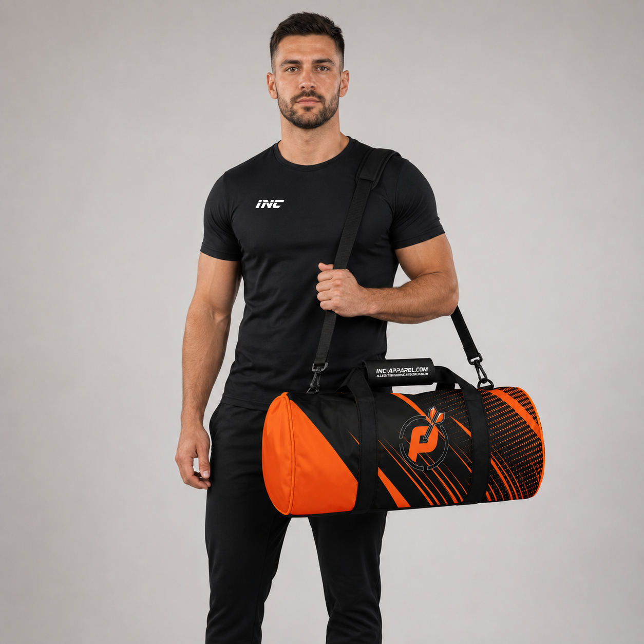 Front view of a man carrying the black and orange Official Prime Sports Darts Academy kit bag over his shoulder, showcasing the official target logo branding.