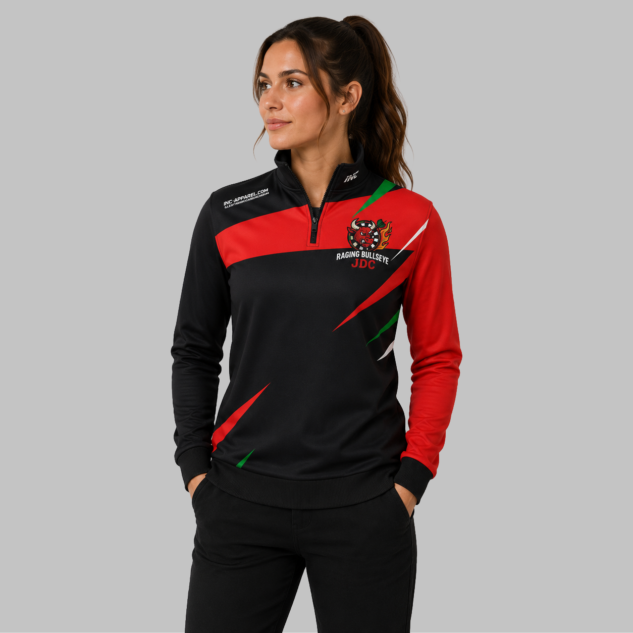 Front view of the unisex Official Raging Bullseye JDC Black Quarter Zip Midlayer, highlighting the athletic team styling, stand-up collar, and official JDC branding.