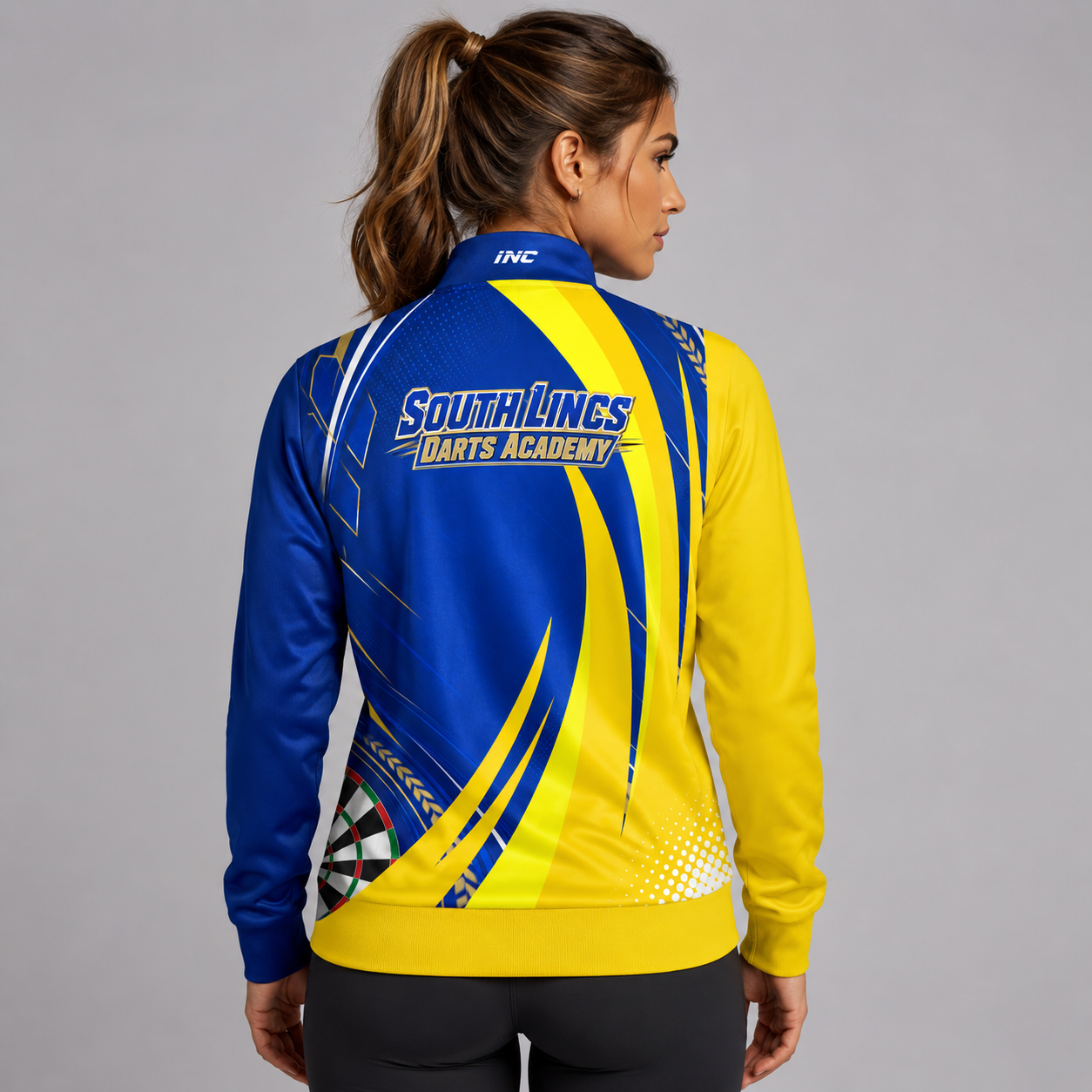 Angled view of the Official South Lincs Darts Academy Tournament Jacket, showing the elasticated cuffs, high-quality fabric texture, and zippered pocket layout.
