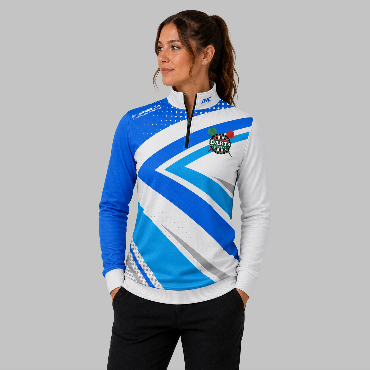 Front view of the unisex Official West Belfast Junior Academy 1/4 Zip Midlayer in Blue, highlighting the athletic styling, stand-up collar, and official academy crest.
