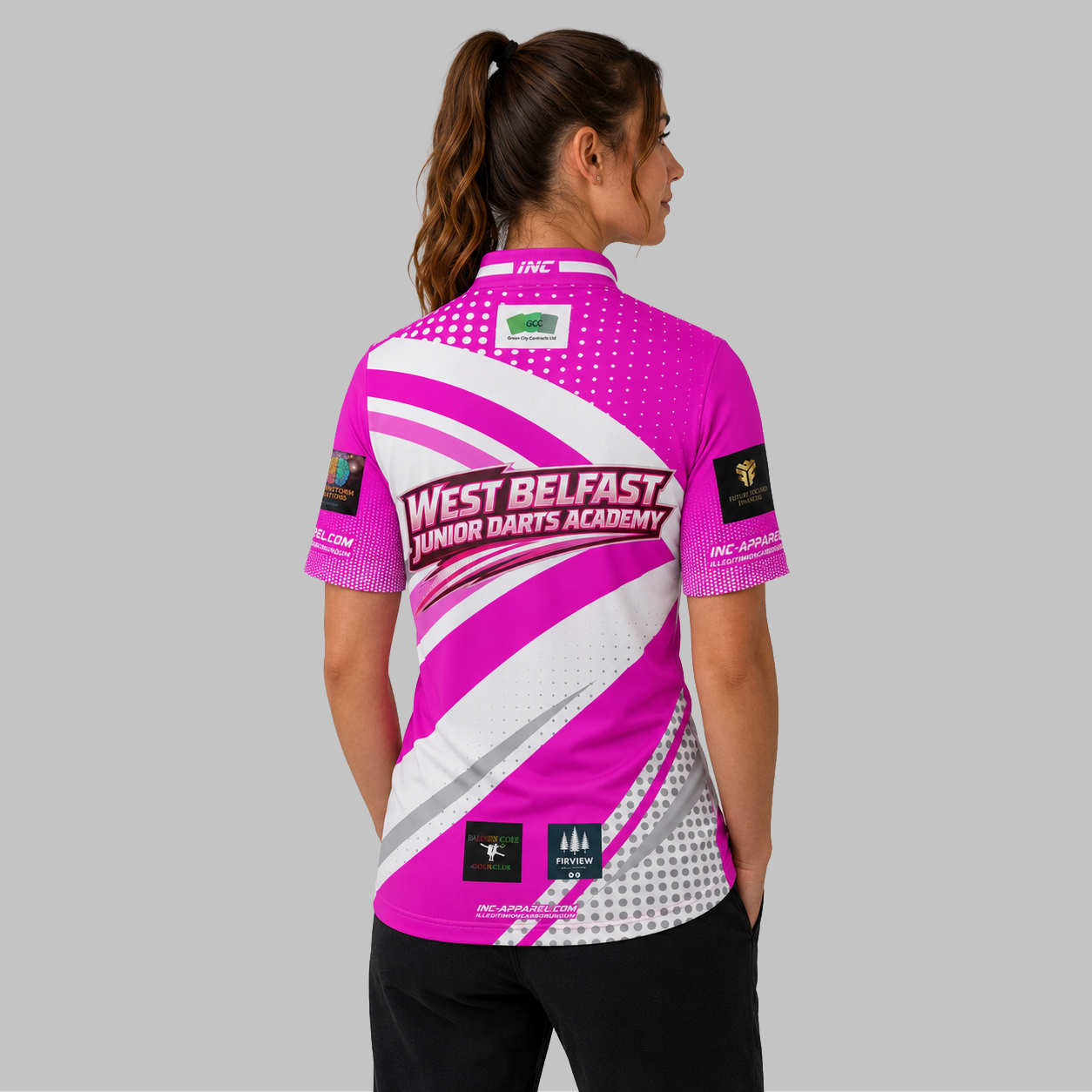 Back view of the Official West Belfast Junior Academy Darts Shirt in Pink, showcasing the clean athletic fit and unrestricted shoulder construction.