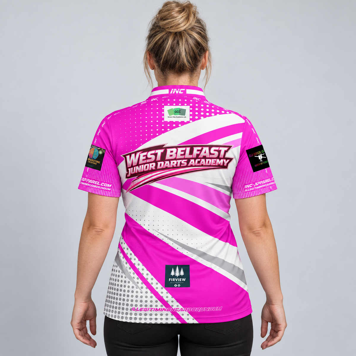 Back view of the Official West Belfast Junior Academy Darts Shirt in Pink, showing the vibrant team colors, professional collar, and sharp sublimated academy crest.
