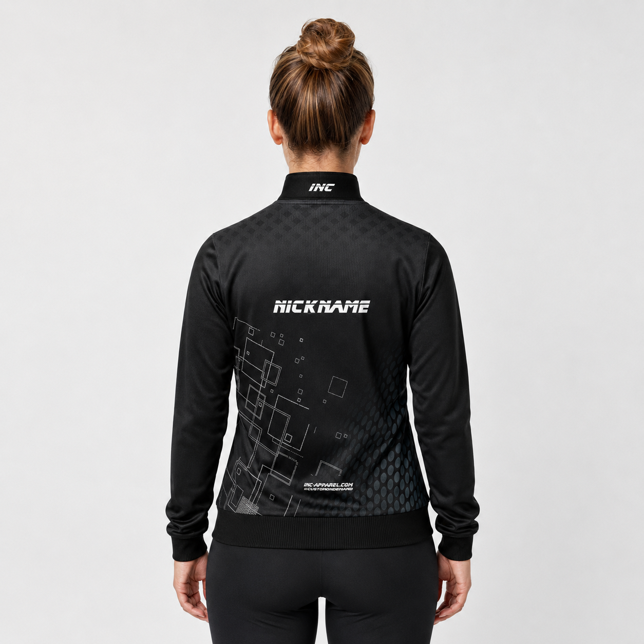 Back view of the unisex Official What's The Point Quarter Zip Midlayer, showcasing the clean athletic silhouette and flexible shoulder construction.