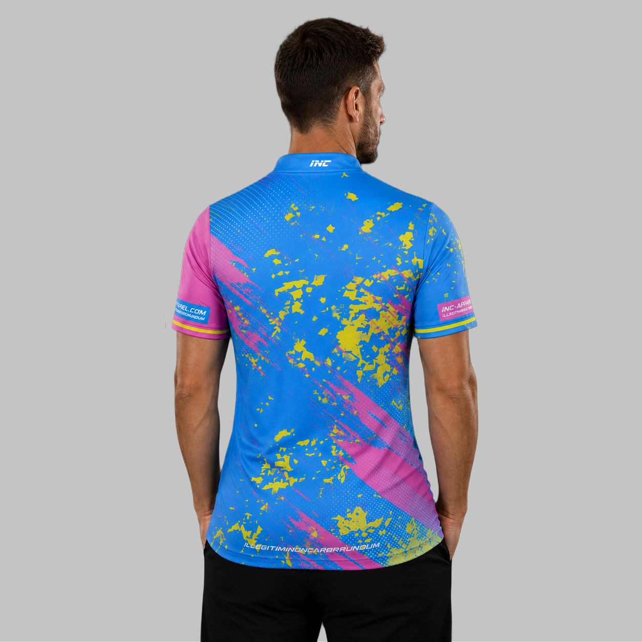 Back view of the Men and Youth Regina blue and pink darts shirt, showing the clean, continuous flow of the blue and pink graphic design across the shoulders.