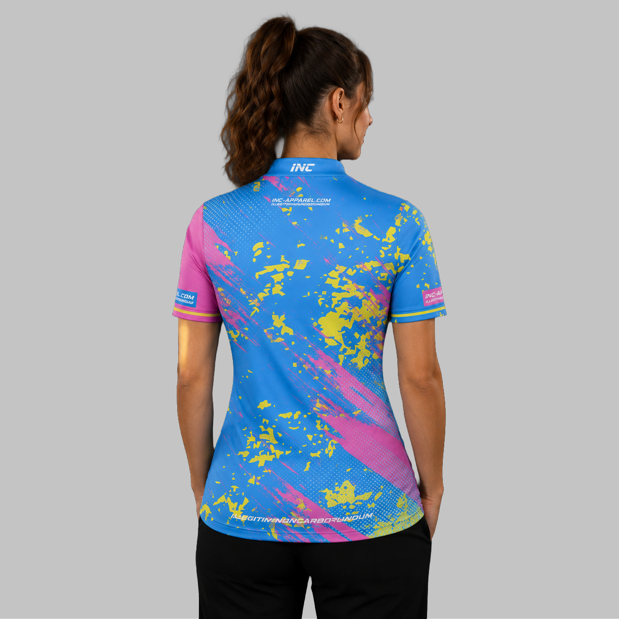Back view of the Women's Regina blue and pink darts shirt, showcasing the seamless flow of the blue and pink graphic pattern across the shoulders.