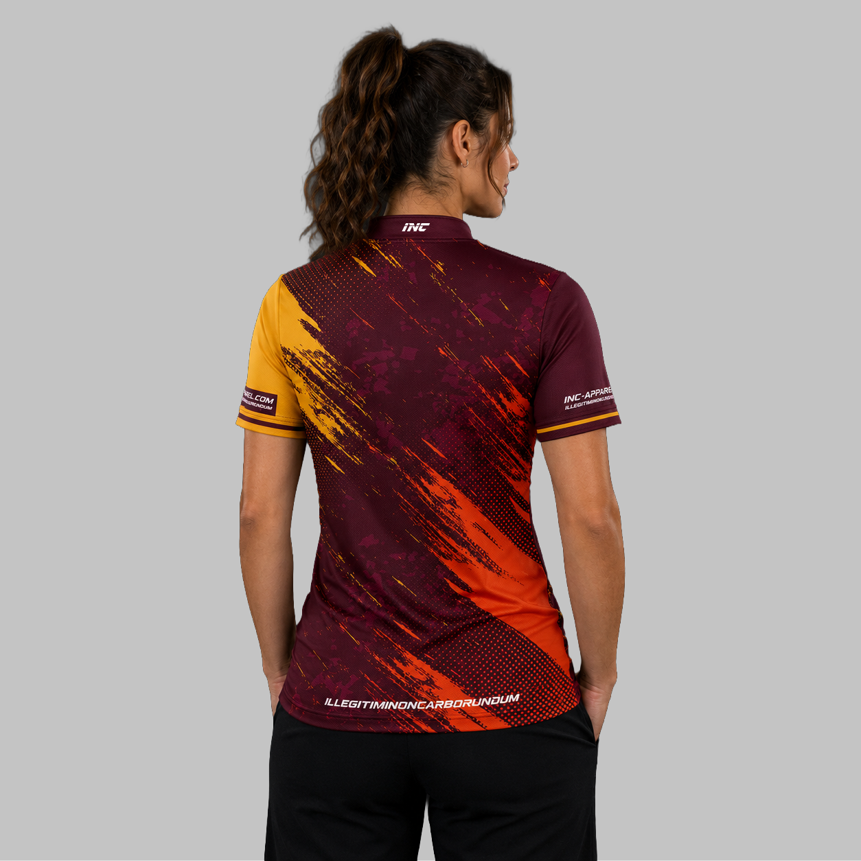 Back view of the Women's Regina burgundy darts shirt, showcasing the seamless flow of the deep burgundy graphic pattern across the shoulders.