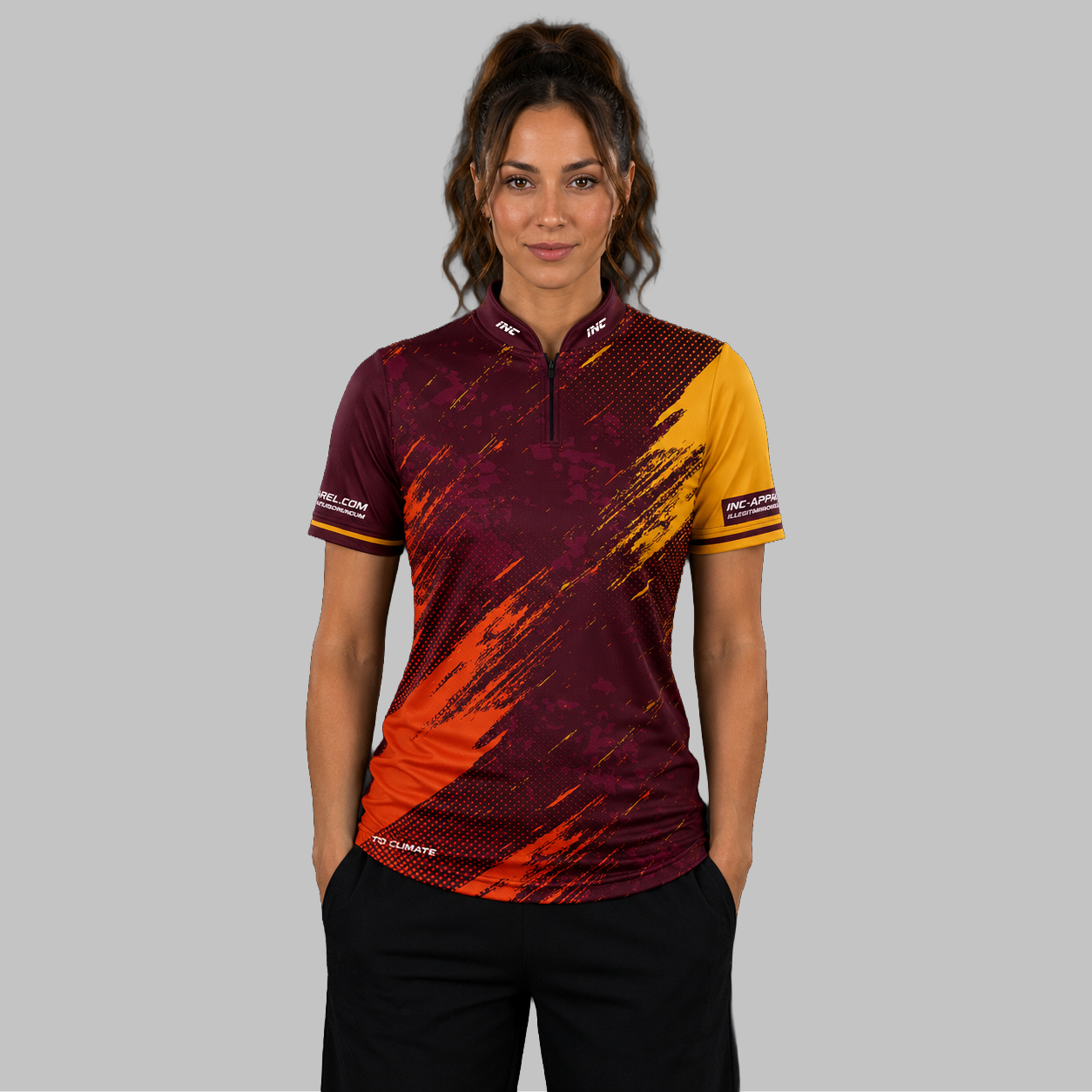 Front view of the Women's Regina burgundy darts shirt, showing the custom-contoured athletic fit and vibrant sublimated geometric design.