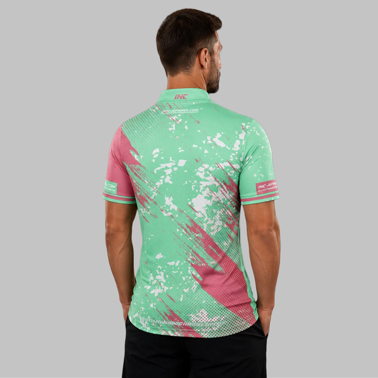 Back view of the Men and Youth Regina green darts shirt, showing the clean, continuous flow of the vibrant green graphic design across the shoulders.