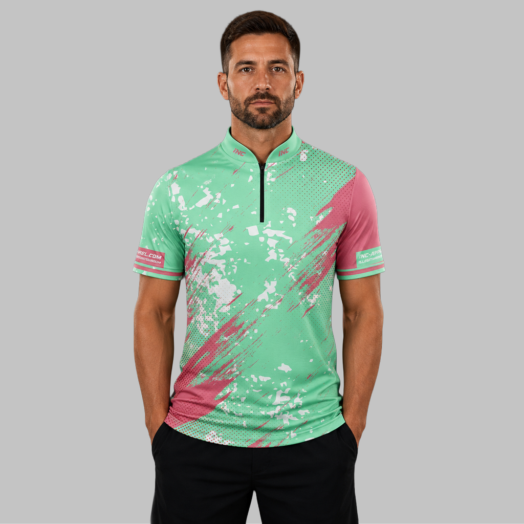 Front view of the Men and Youth Regina green darts shirt, showcasing the dynamic athletic jersey design with its sharp, vibrant geometric layout.