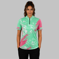 Front view of the Women's Regina green darts shirt, showing the custom-contoured athletic fit and vibrant sublimated geometric design.
